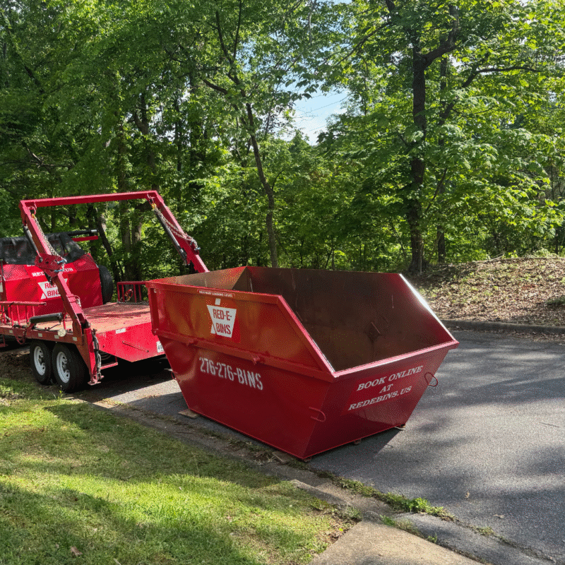 10 yard Red-E-Bins dumpster being placed on residential street in Bristol VA for a home cleanout or light remodel project